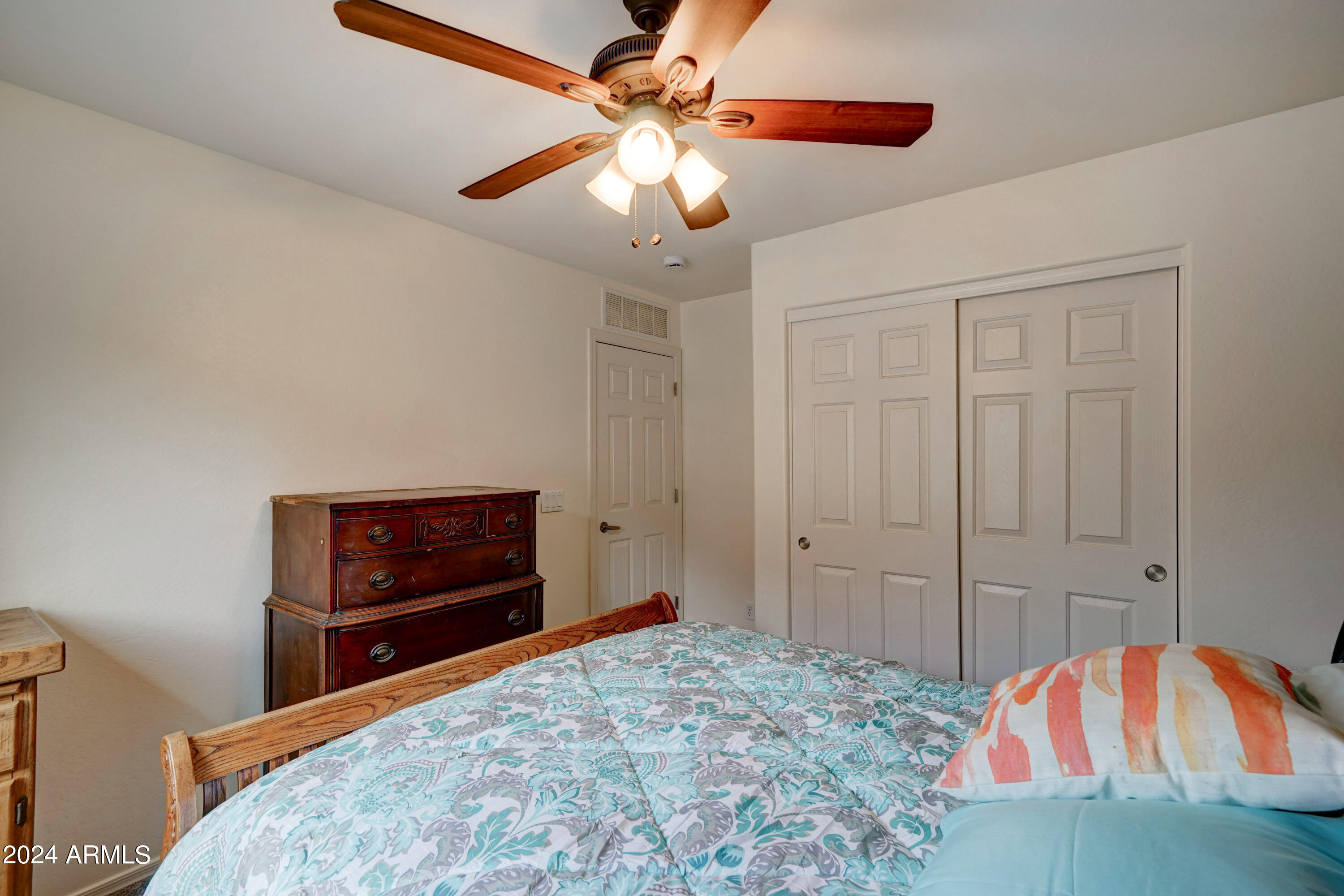 2101 South Meridian Road, Unit 157 Apache Junction, AZ 85120 - Photo 14 of 51 a bedroom with a bed and a dresser