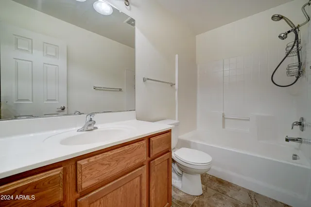 a bathroom with a sink toilet tub and shower