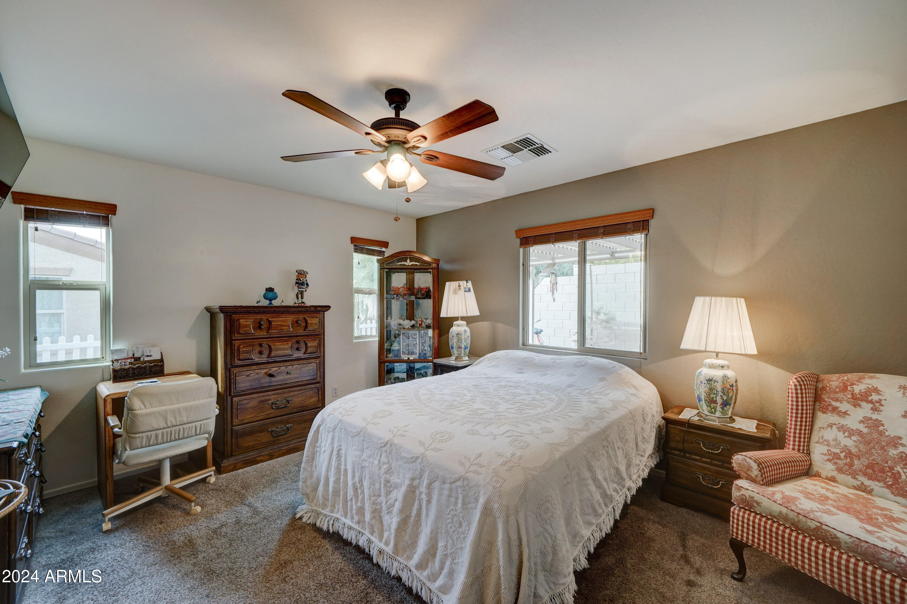 2101 South Meridian Road, Unit 157 Apache Junction, AZ 85120 - Photo 16 of 51 a bedroom with a bed furniture and a window