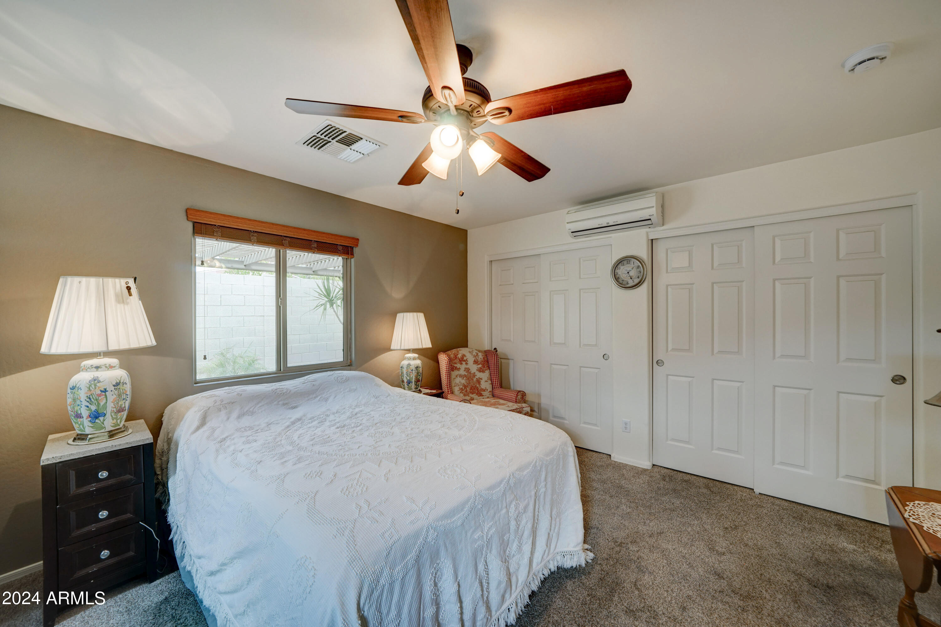 2101 South Meridian Road, Unit 157 Apache Junction, AZ 85120 - Photo 19 of 51 a bedroom with a bed and a lamp