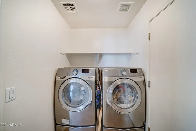 a view of washer and dryer in a utility room