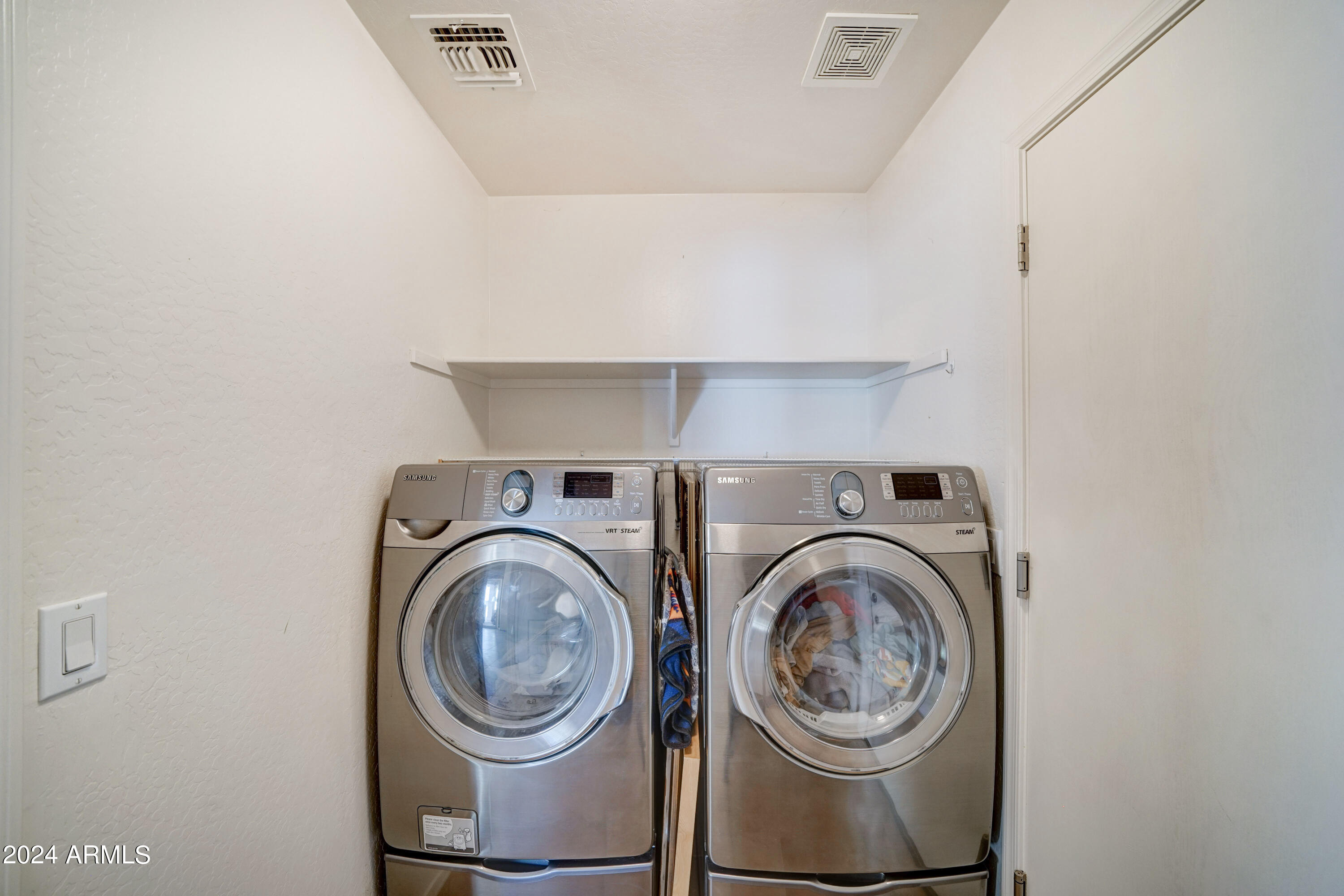 2101 South Meridian Road, Unit 157 Apache Junction, AZ 85120 - Photo 21 of 51 a view of washer and dryer in a utility room