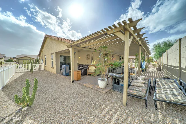 a very nice looking room with a large window and furniture