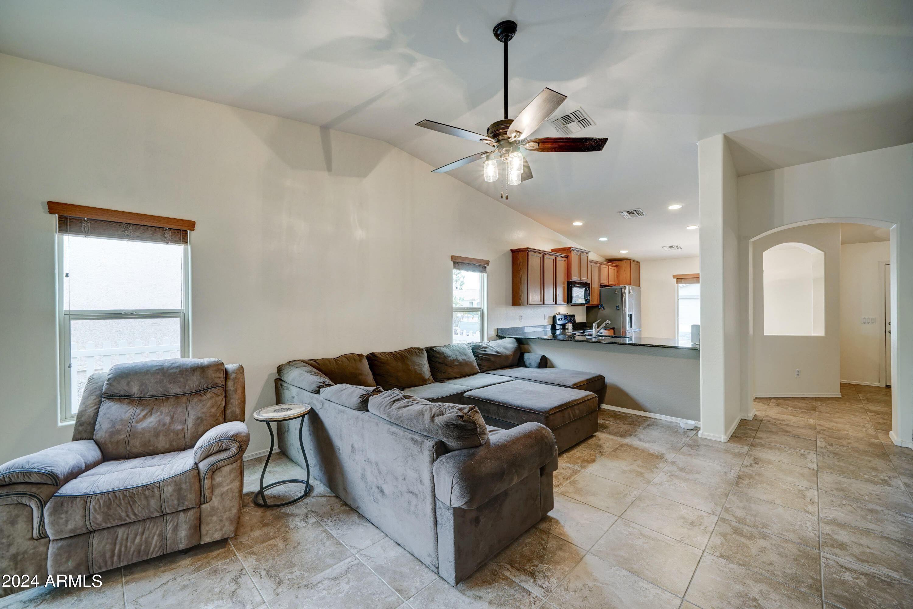 2101 South Meridian Road, Unit 157 Apache Junction, AZ 85120 - Photo 8 of 51 a living room with furniture and a ceiling fan