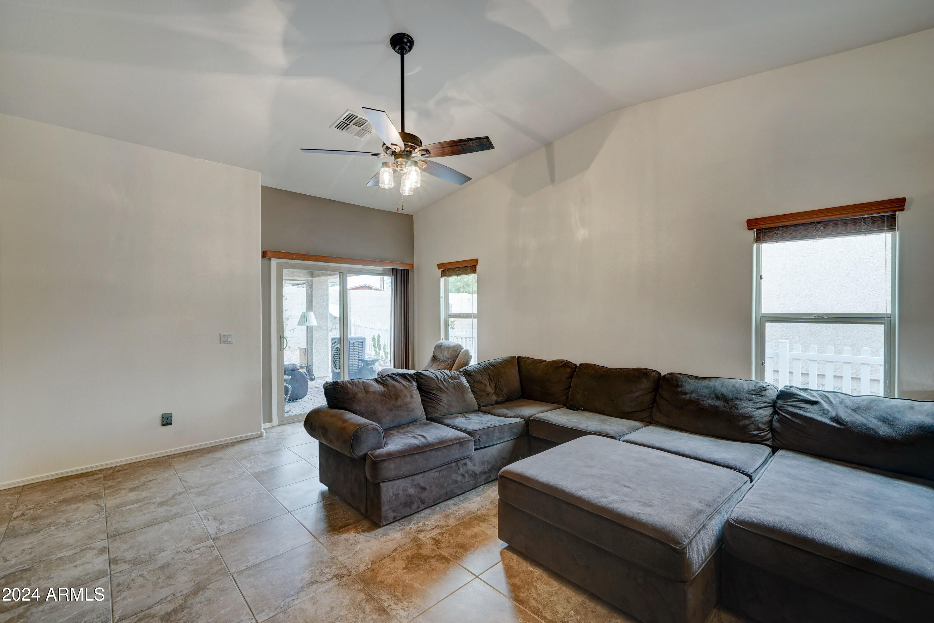 2101 South Meridian Road, Unit 157 Apache Junction, AZ 85120 - Photo 9 of 51 a living room with furniture and a window