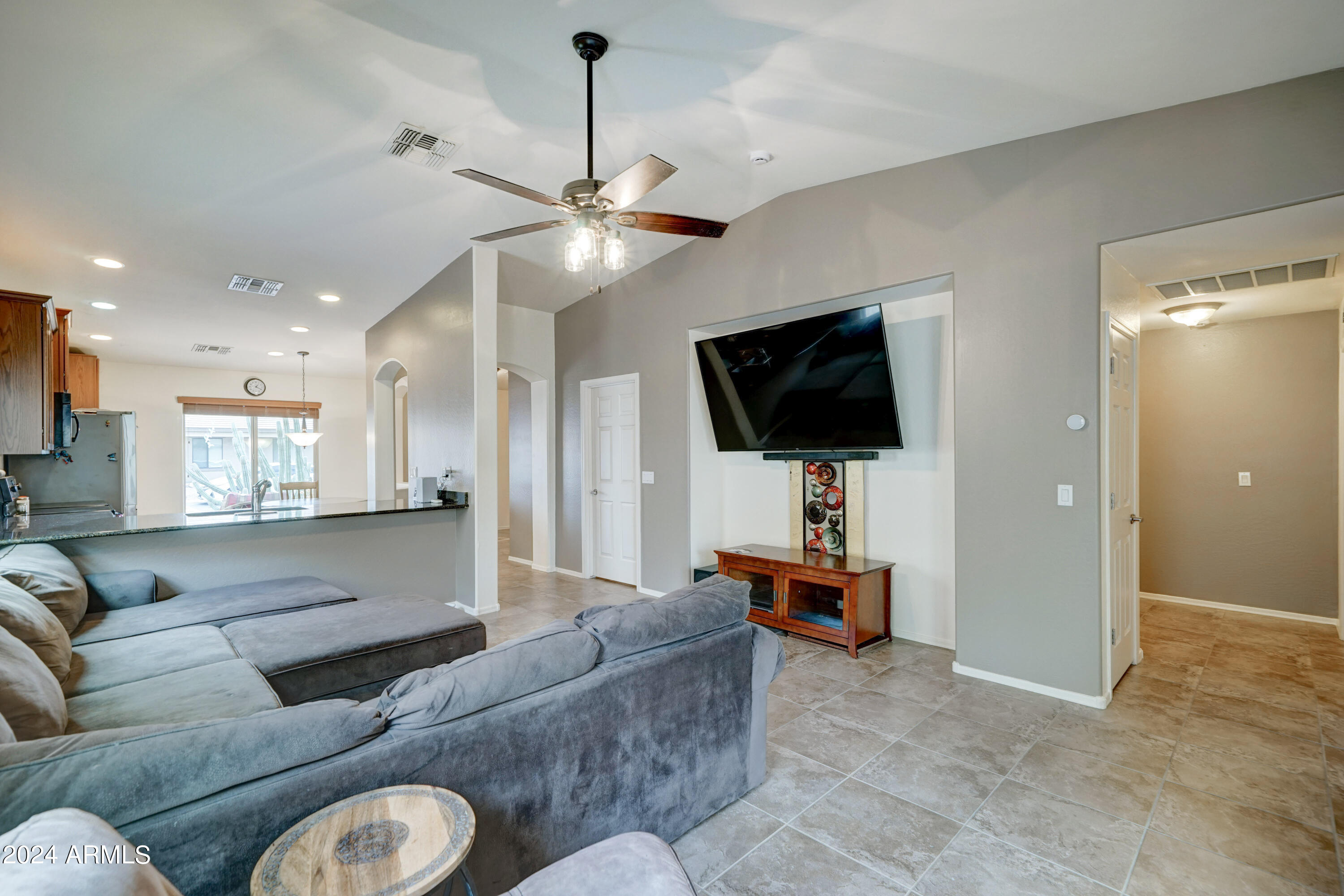 2101 South Meridian Road, Unit 157 Apache Junction, AZ 85120 - Photo 10 of 51 a living room with furniture and a flat screen tv