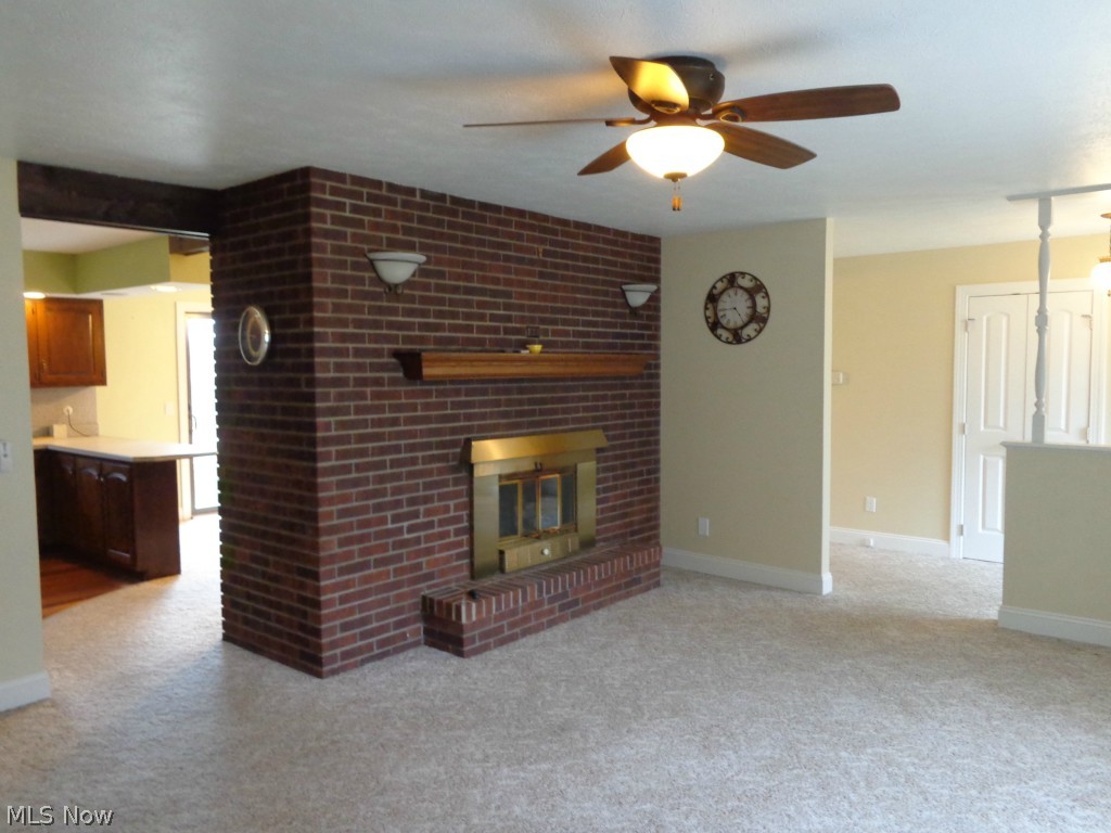 1208 Taylor Road Sandusky, OH 44870 - Photo 6 of 18 View #1 of the living room w/bricked gas fireplace.