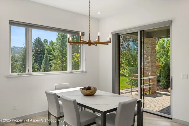 a bathroom with a white bath tub sitting next to a window