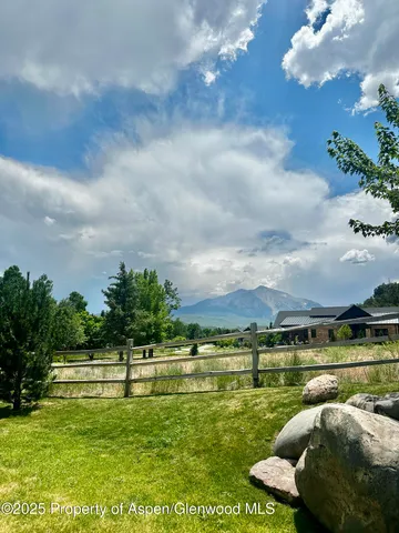 a view of a golf course with a lake