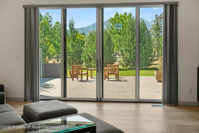 a kitchen with a sink a stove a refrigerator and a window