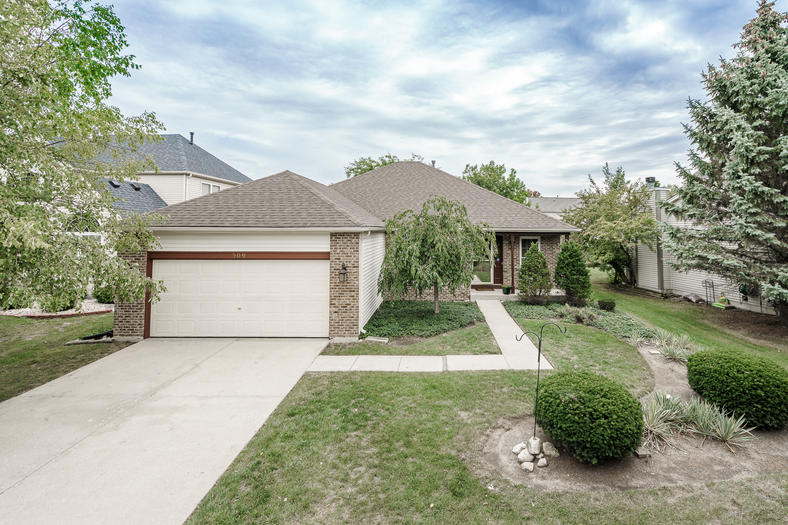 front view of a house with a yard