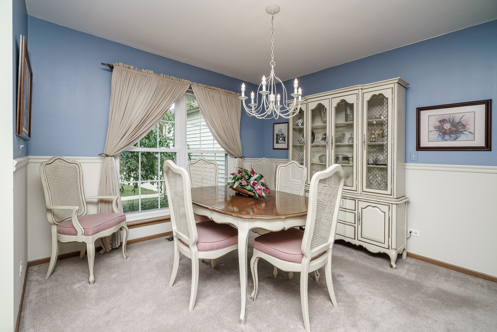 309 Spring Valley Way Round Lake, IL 60073 - Photo 4 of 26 a view of a dining room with furniture wooden floor and chandelier