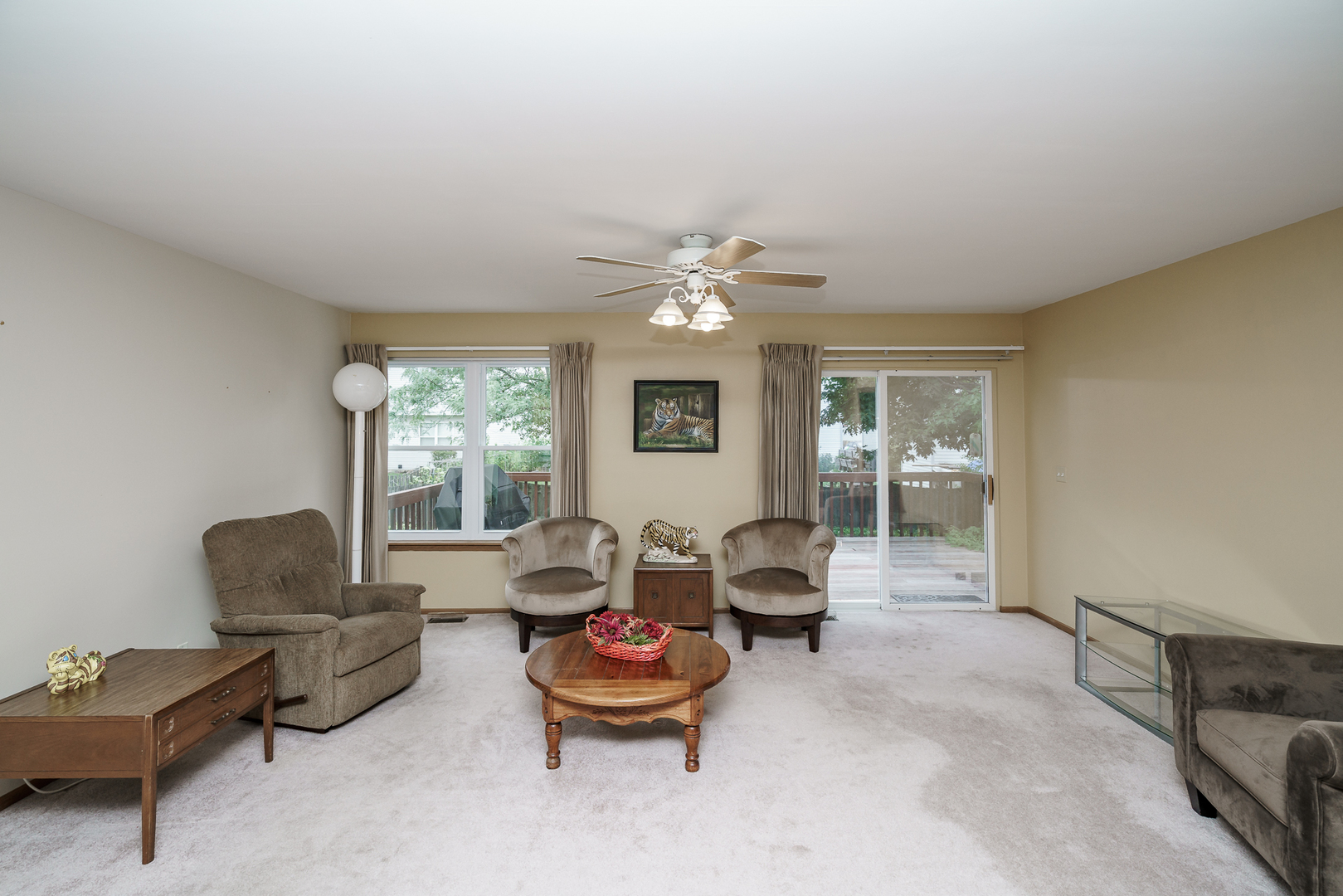 309 Spring Valley Way Round Lake, IL 60073 - Photo 8 of 26 a living room with furniture and a large window