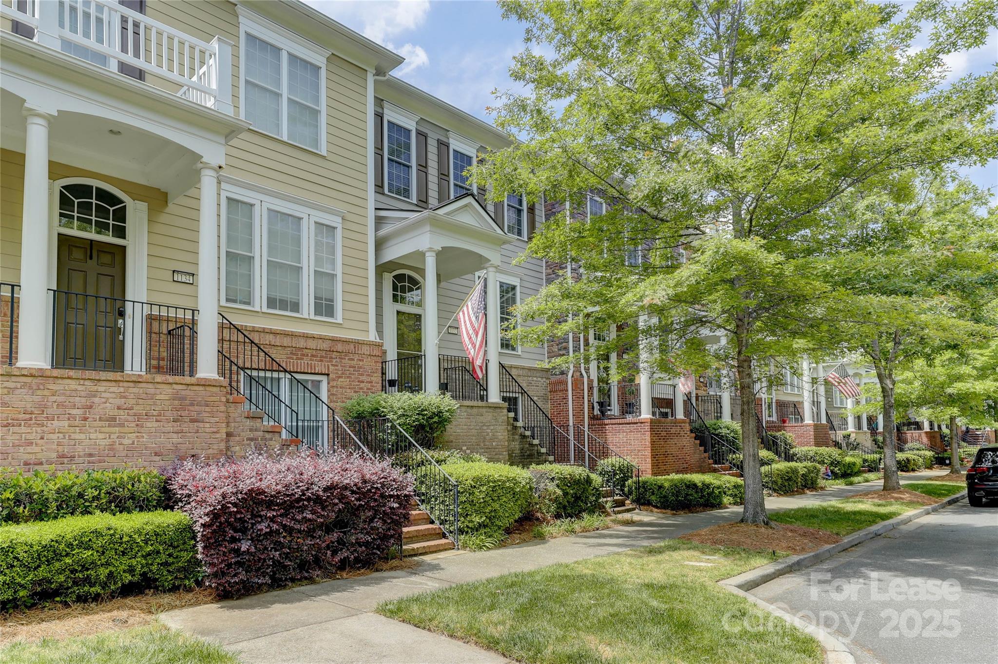 1132 Drayton Court Fort Mill, SC 29708 - Photo 1 of 48 a front view of a house with a garden