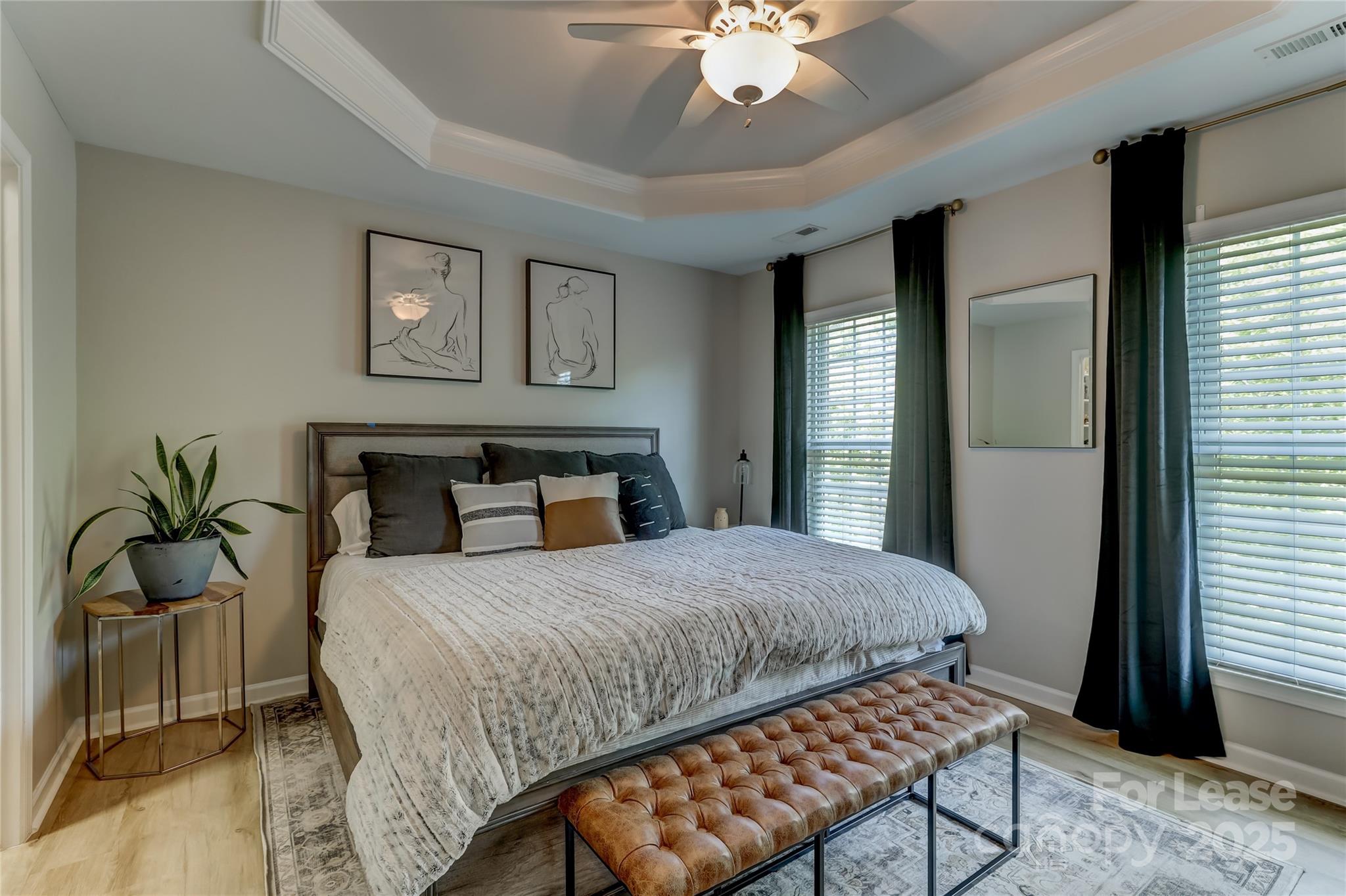 1132 Drayton Court Fort Mill, SC 29708 - Photo 30 of 48 a bedroom with a bed and a chandelier