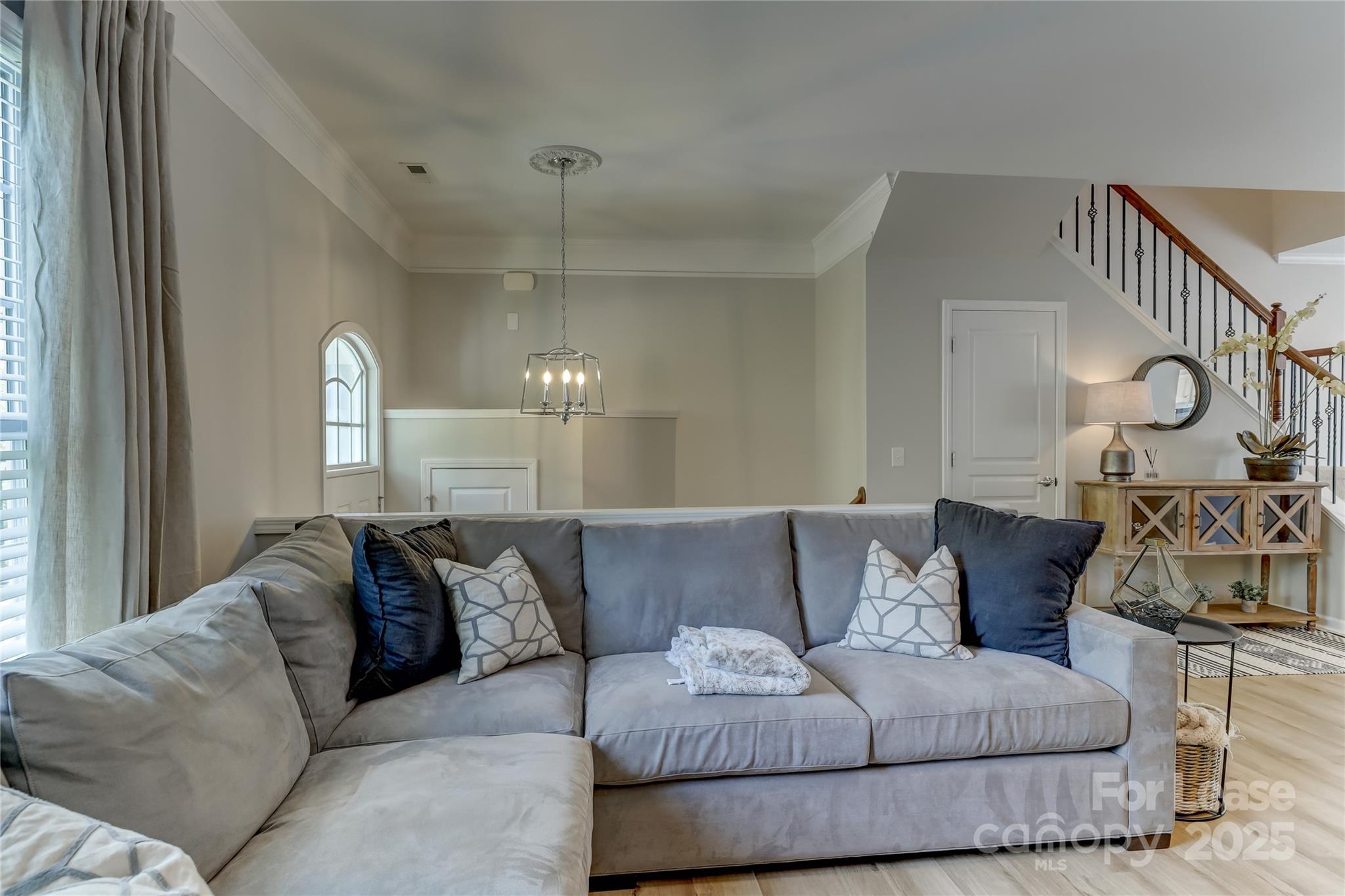 1132 Drayton Court Fort Mill, SC 29708 - Photo 8 of 48 a living room with furniture and a chandelier
