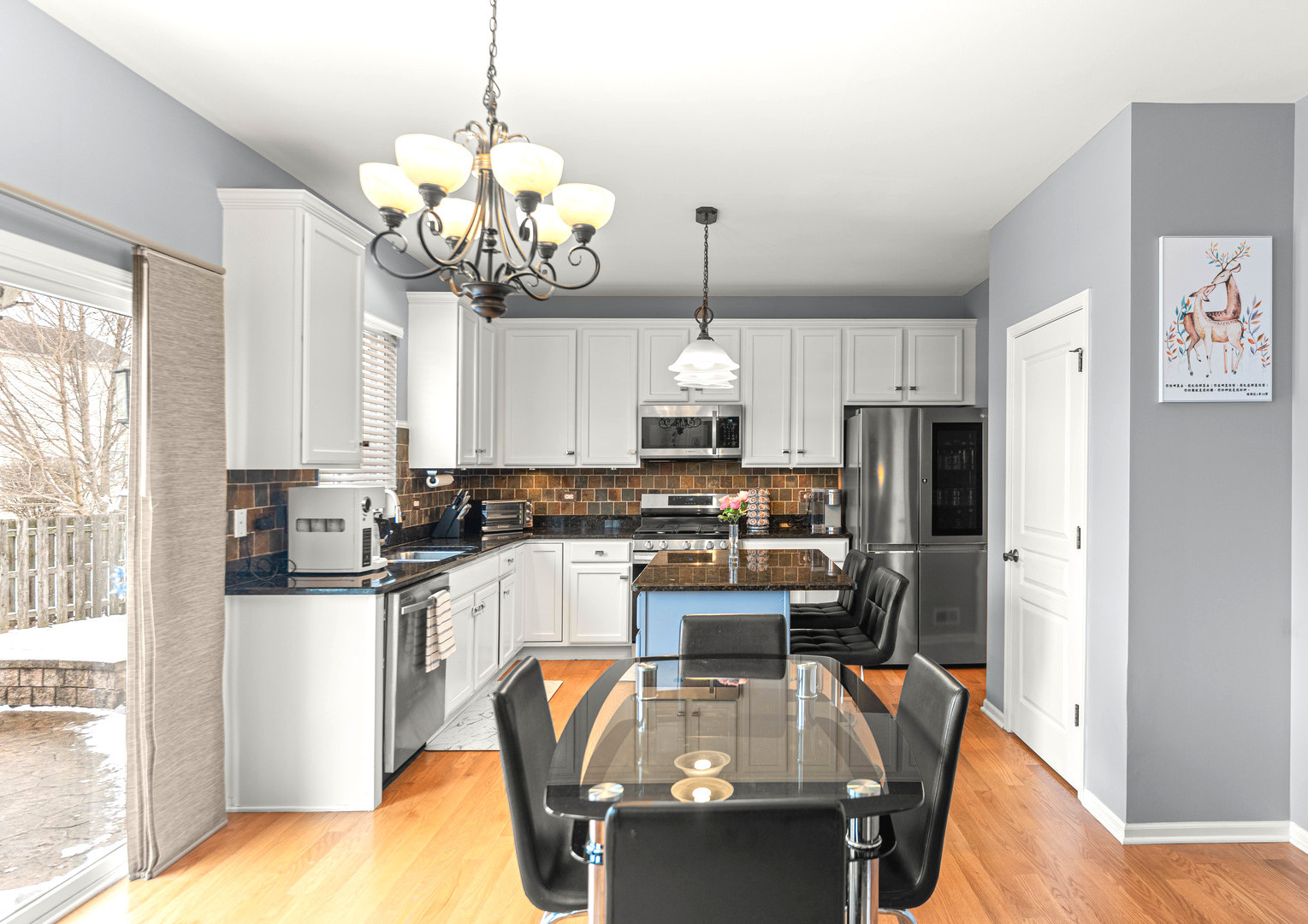 7 Pampas Court Bolingbrook, IL 60490 - Photo 12 of 39 a kitchen with stainless steel appliances granite countertop a sink a stove and a refrigerator
