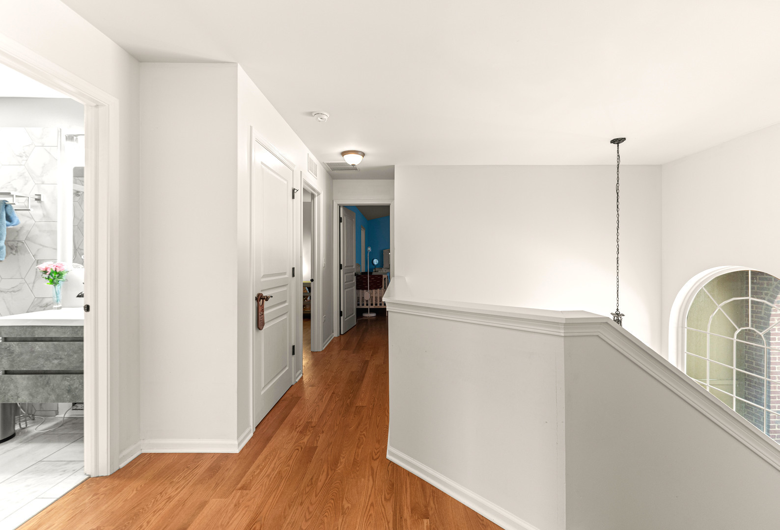 7 Pampas Court Bolingbrook, IL 60490 - Photo 20 of 39 a view of a hallway with wooden floor and staircase