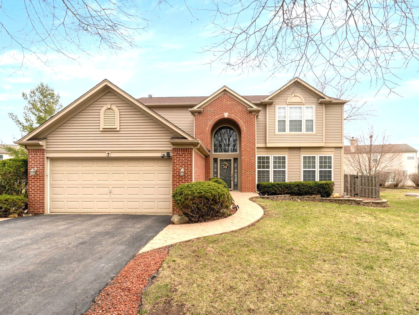 7 Pampas Court Bolingbrook, IL 60490 - Photo 2 of 39 a front view of a house with a yard and garage