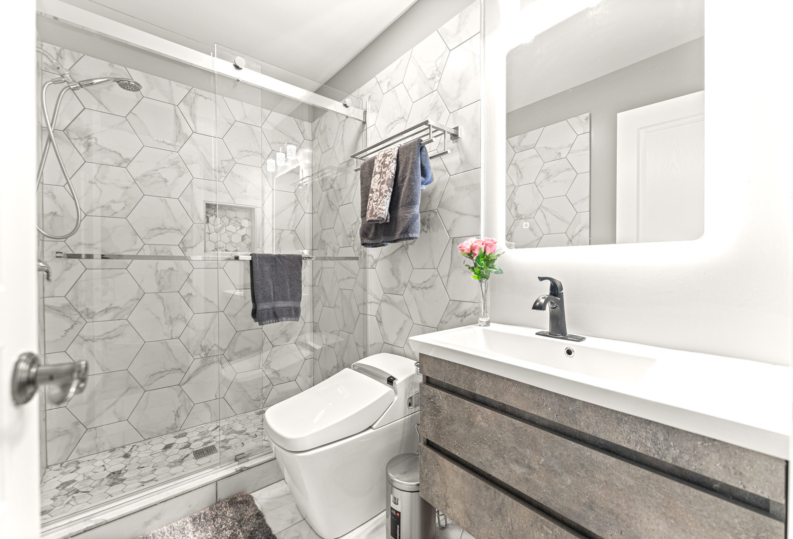 7 Pampas Court Bolingbrook, IL 60490 - Photo 30 of 39 a bathroom with a sink a toilet and shower