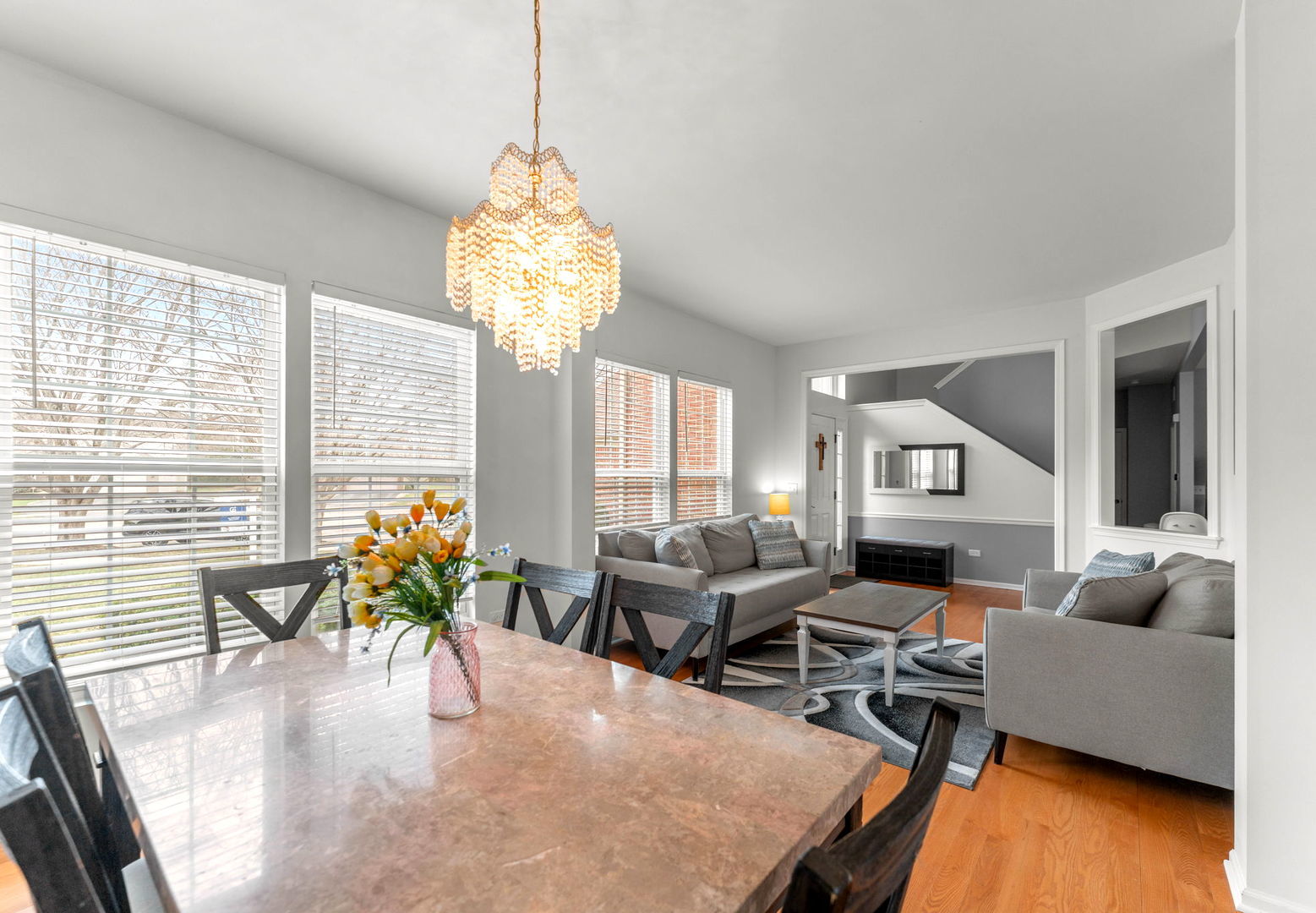 7 Pampas Court Bolingbrook, IL 60490 - Photo 6 of 39 a living room with furniture and a chandelier