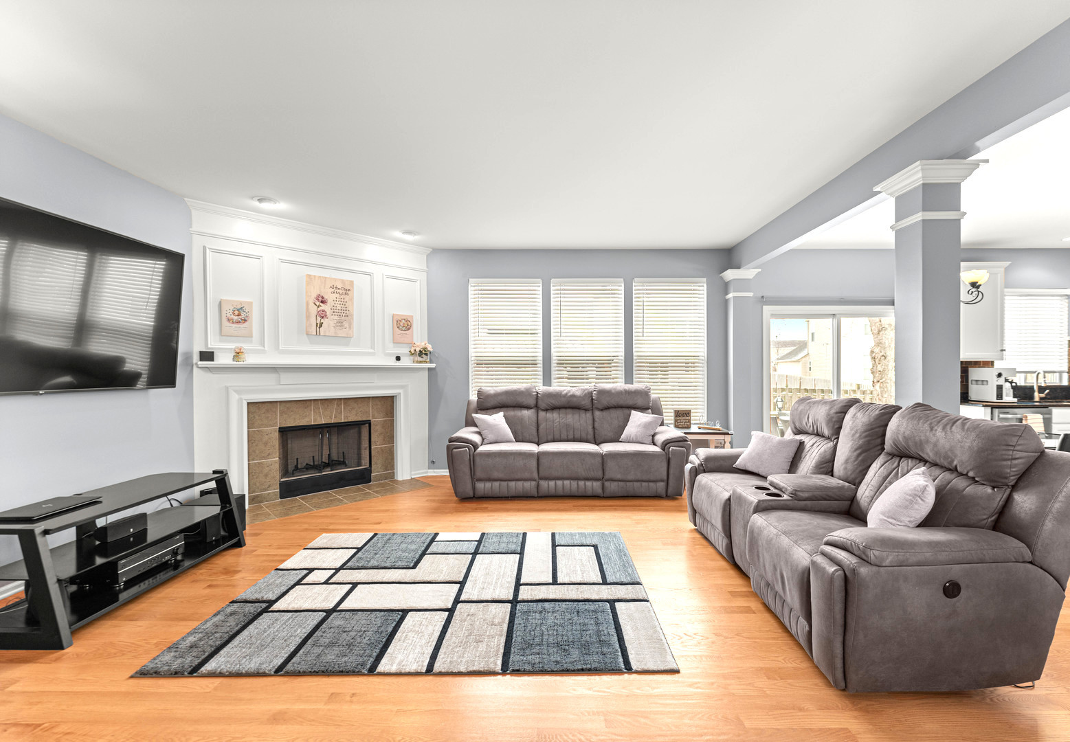 7 Pampas Court Bolingbrook, IL 60490 - Photo 7 of 39 a living room with furniture a flat screen tv and a fireplace