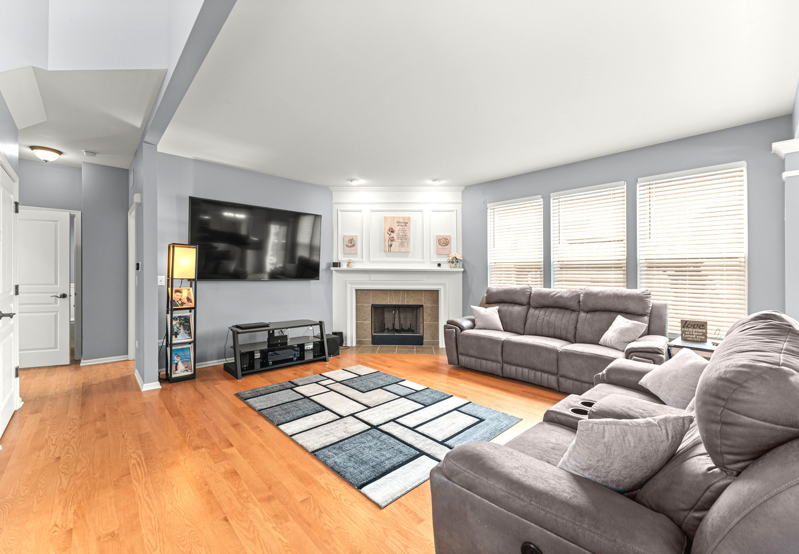 7 Pampas Court Bolingbrook, IL 60490 - Photo 8 of 39 a living room with furniture fireplace and flat screen tv