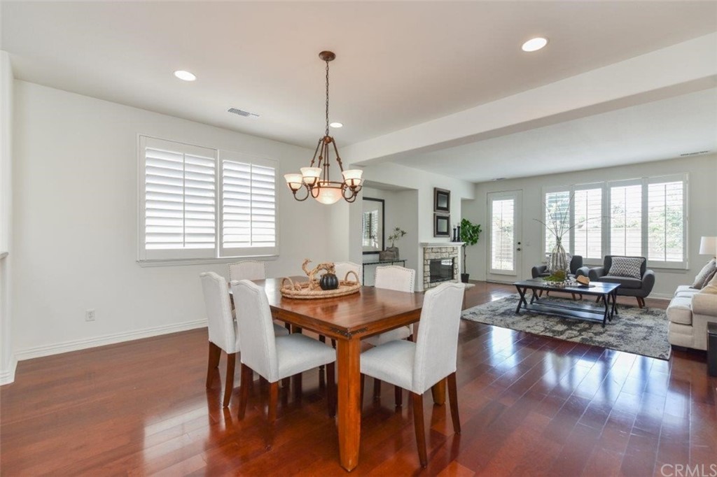 17 Stonegate Irvine, CA 92602 - Photo 13 of 72 a view of a dining room with furniture window and wooden floor