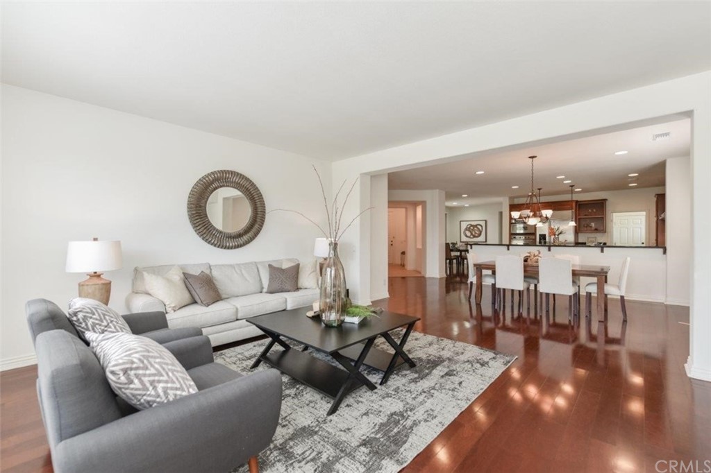 17 Stonegate Irvine, CA 92602 - Photo 16 of 72 a living room with furniture and a wooden floor
