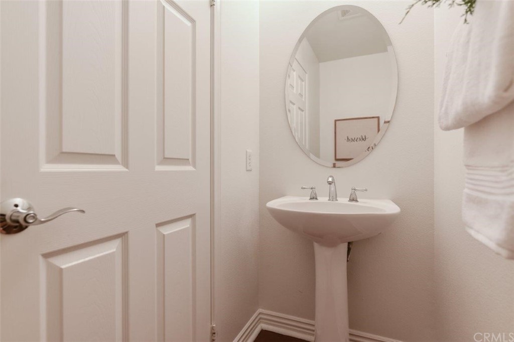 17 Stonegate Irvine, CA 92602 - Photo 33 of 72 a bathroom with a sink and a mirror