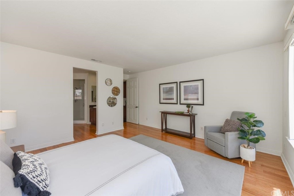 17 Stonegate Irvine, CA 92602 - Photo 40 of 72 a bedroom with a bed and a table