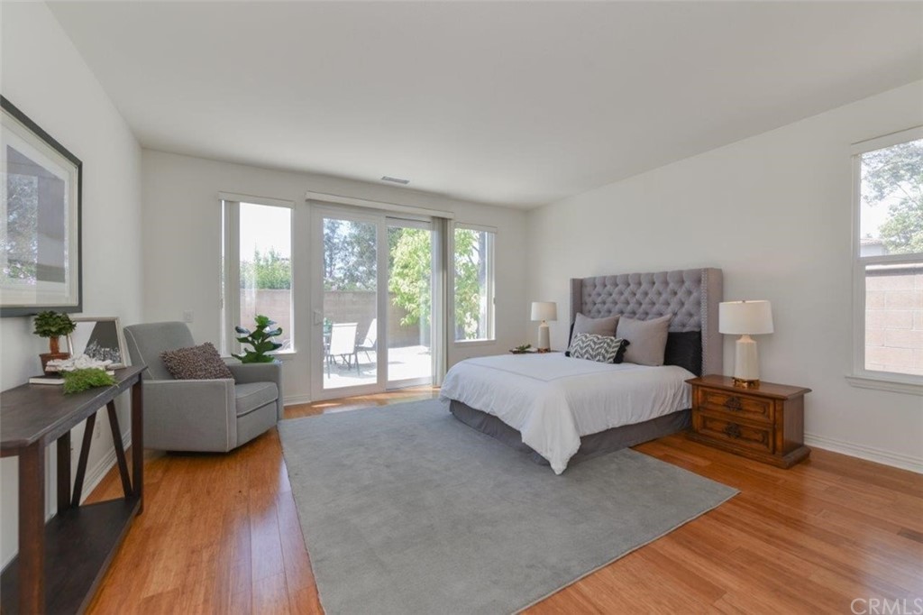 17 Stonegate Irvine, CA 92602 - Photo 42 of 72 a spacious bedroom with a bed and a couch