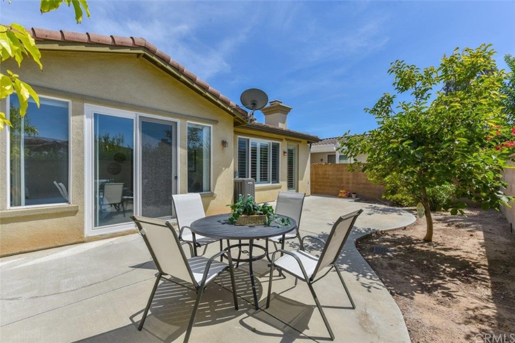 17 Stonegate Irvine, CA 92602 - Photo 53 of 72 a view of a patio with table and chairs and potted plants