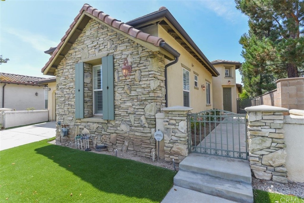 17 Stonegate Irvine, CA 92602 - Photo 59 of 72 a front view of house with a garden