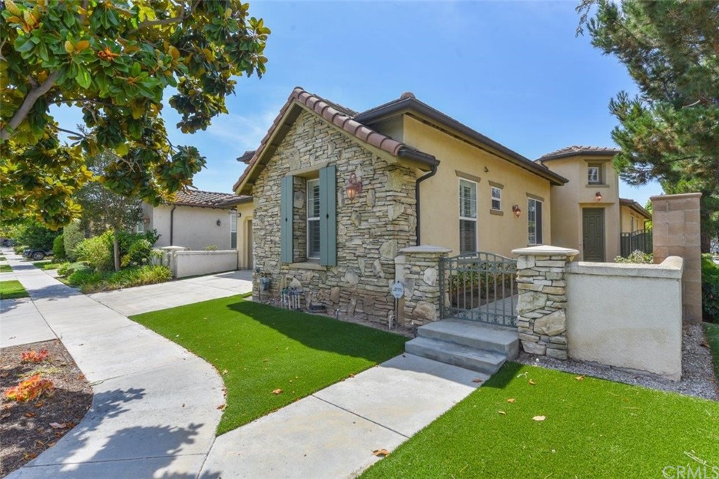 17 Stonegate Irvine, CA 92602 - Photo 60 of 72 a front view of a house with a garden