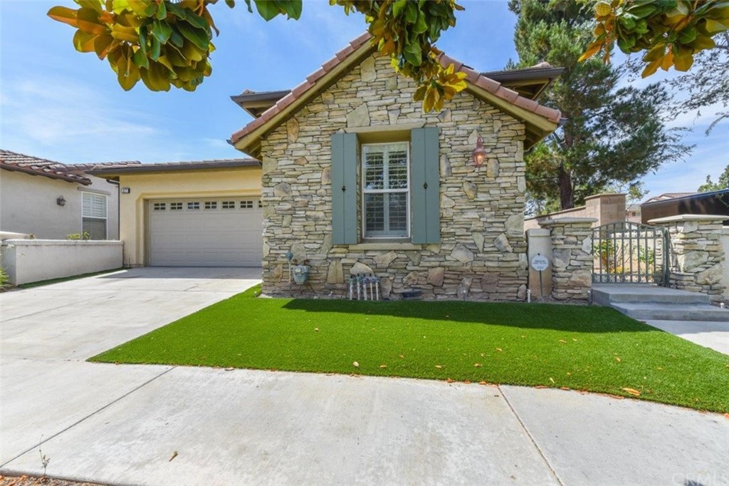 17 Stonegate Irvine, CA 92602 - Photo 64 of 72 a view of a house with a yard and a garden