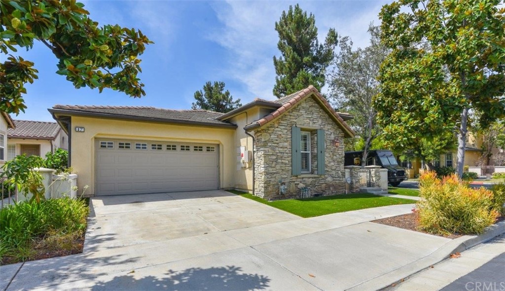 17 Stonegate Irvine, CA 92602 - Photo 65 of 72 a front view of house with yard garage and green space