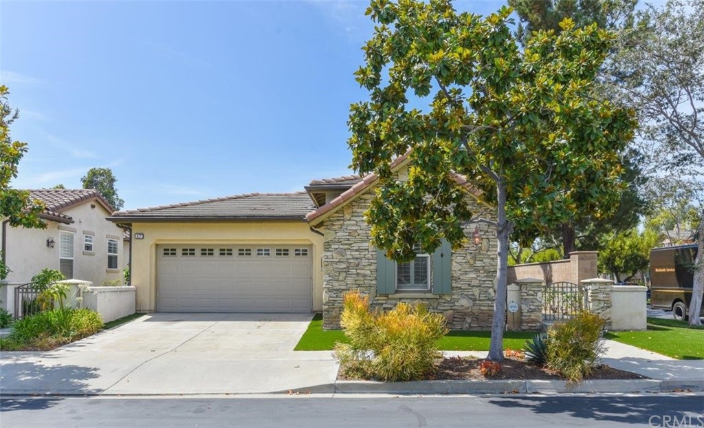 17 Stonegate Irvine, CA 92602 - Photo 67 of 72 a front view of a house with a yard and garage