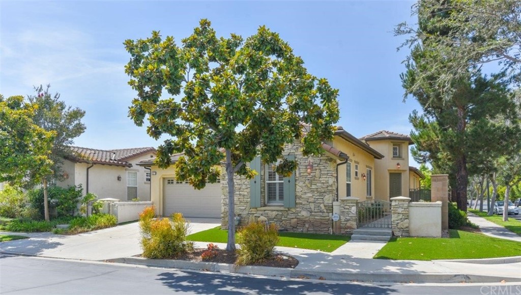17 Stonegate Irvine, CA 92602 - Photo 68 of 72 a front view of a house with garden and trees