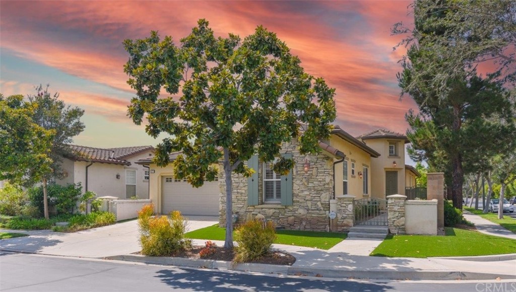 17 Stonegate Irvine, CA 92602 - Photo 69 of 72 a front view of a house with garden and trees