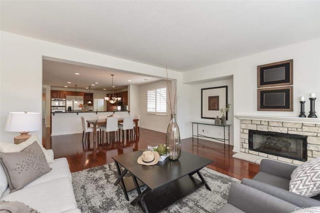 17 Stonegate Irvine, CA 92602 - Photo 8 of 72 a living room with furniture and a fireplace