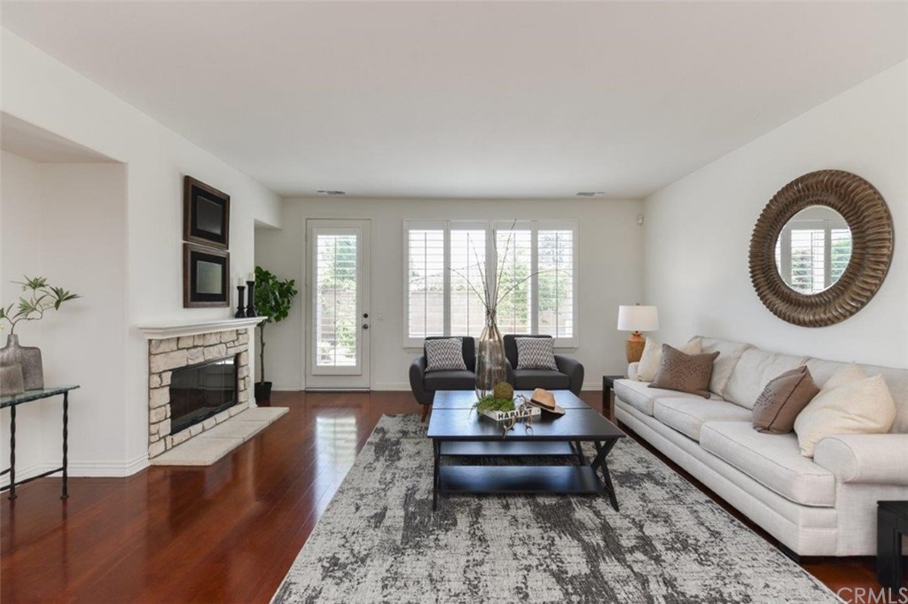 17 Stonegate Irvine, CA 92602 - Photo 10 of 72 a living room with furniture and a fireplace