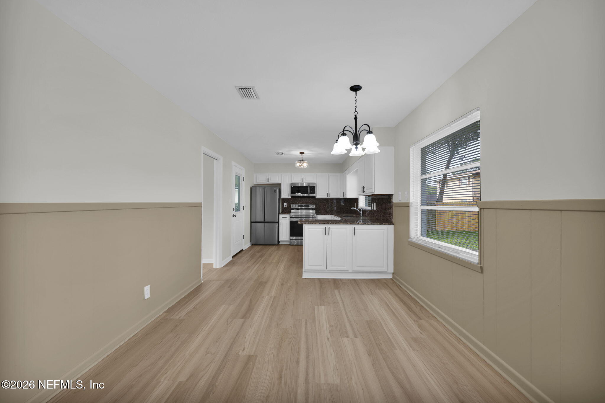 8544 Sanchez Road Jacksonville, FL 32217 - Photo 24 of 46 a view of a kitchen with microwave and refrigerator