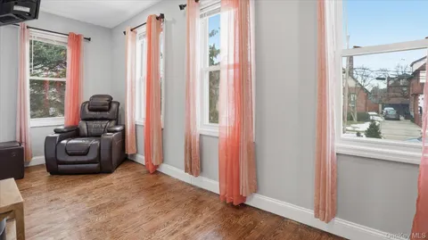 a bedroom with two beds and a window