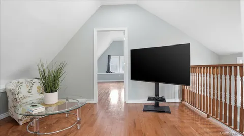 a bedroom with furniture and a book shelf