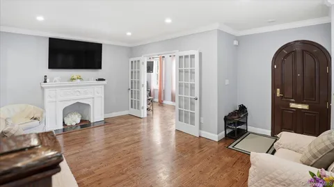 a kitchen with stainless steel appliances granite countertop a stove a refrigerator and a microwave