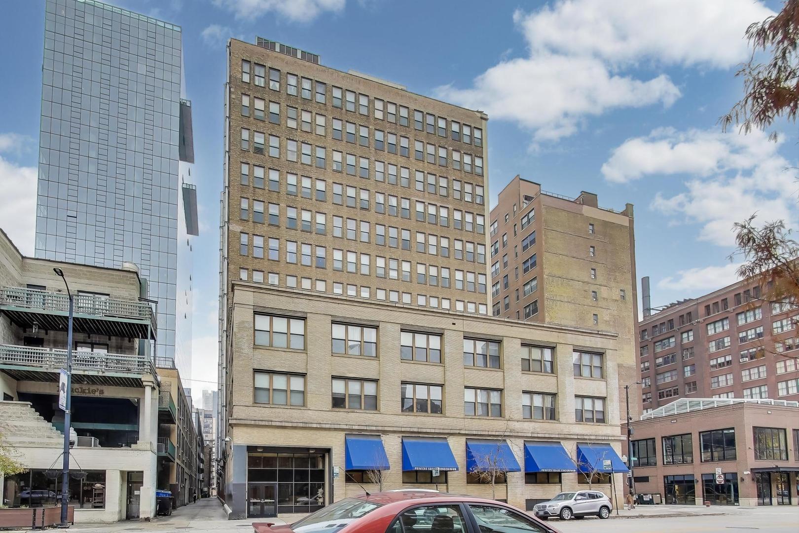 780 South Federal Street, Unit 903 Chicago, IL 60605 - Photo 2 of 31 a front view of a building with lot of cars