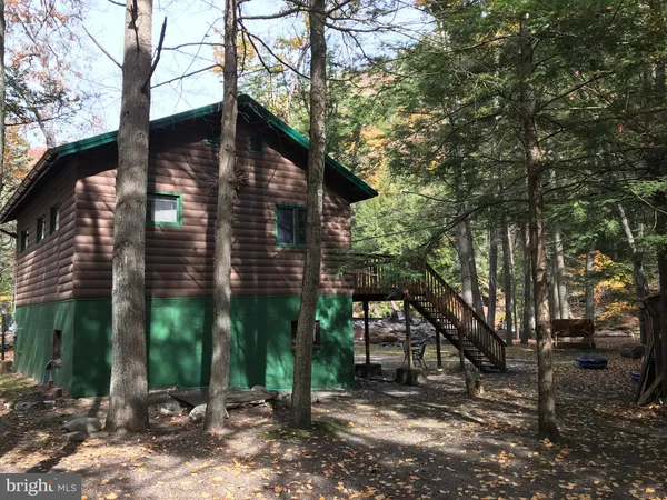 a view of a house with a tree
