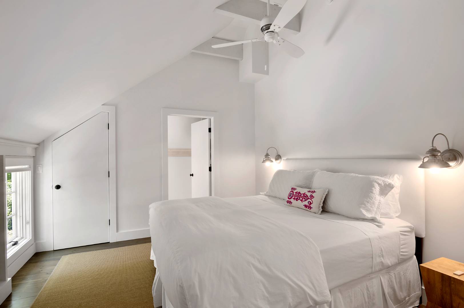 4 Lee Lane Wainscott, NY 11975 - Photo 12 of 14 a bedroom with a bed and a chandelier