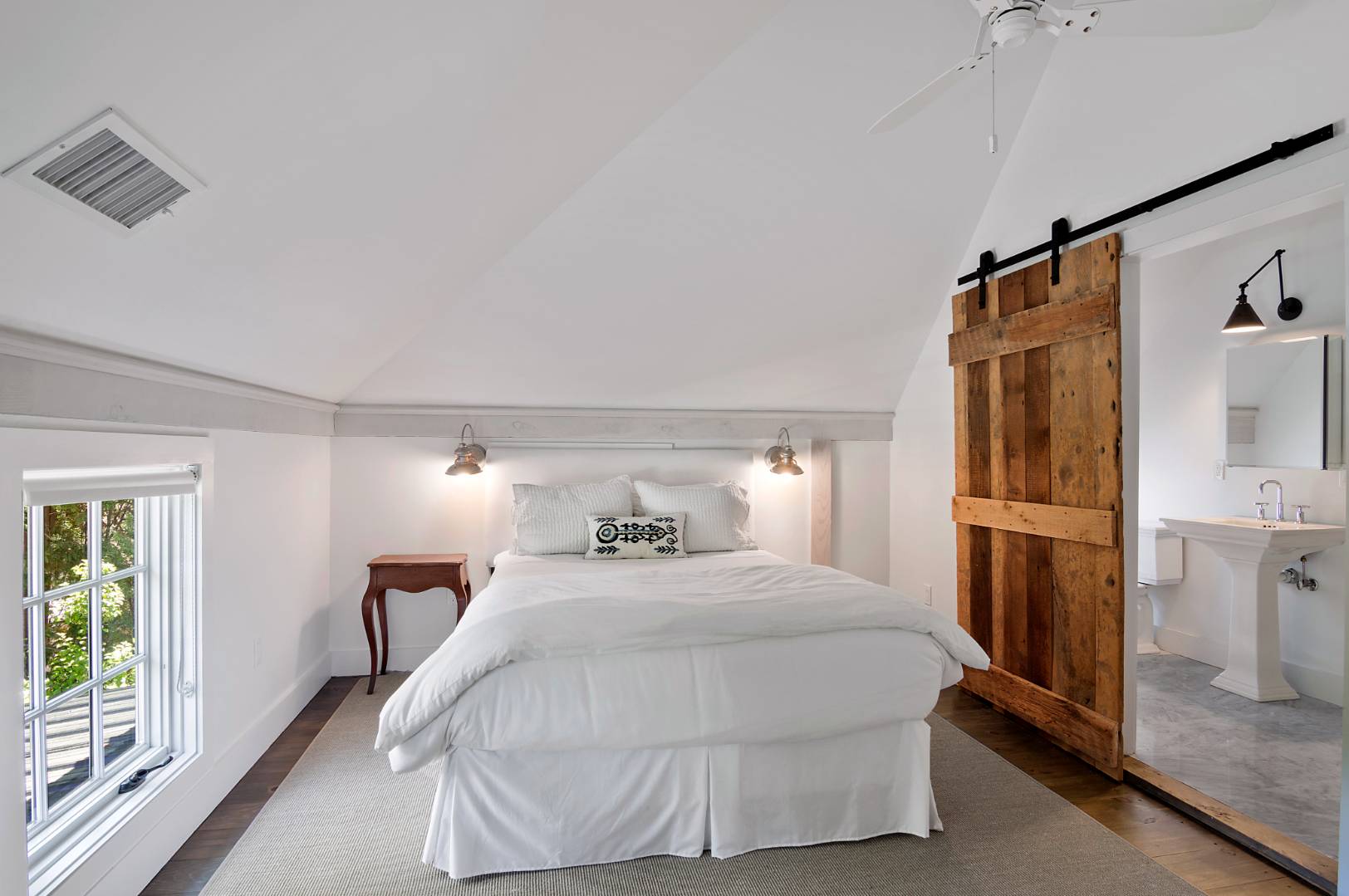 4 Lee Lane Wainscott, NY 11975 - Photo 10 of 14 a bedroom with a bed and wooden floor